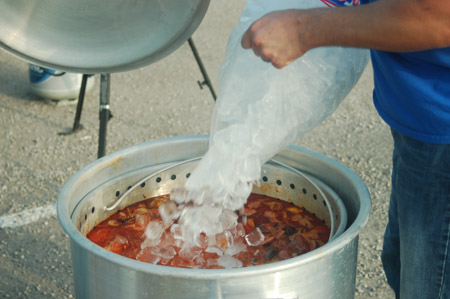 Adding ice to the crawfish boil