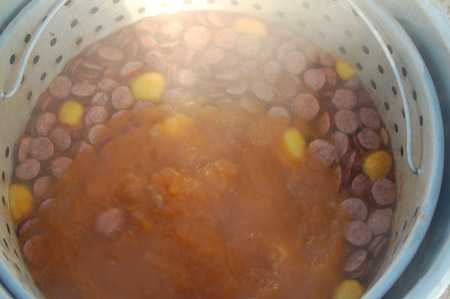 Adding the sausage to the boil